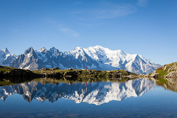 Male athlete enjoys a run in the French Alps stock photo