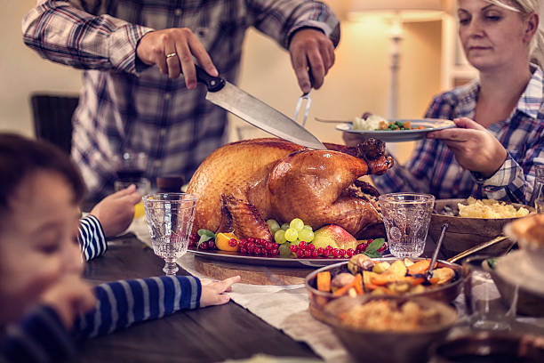 istock Carving Traditional Stuffed Turkey for Dinner 610252902
