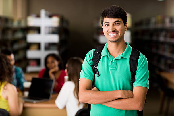 Nepalese student standing with arms crossed and smiling