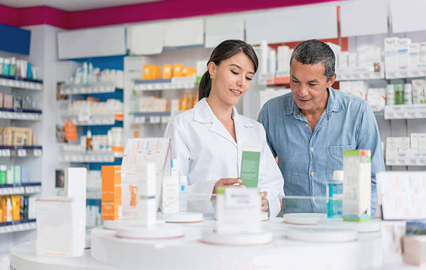 istock Man talking to pharmacist at a drugstore 610254288