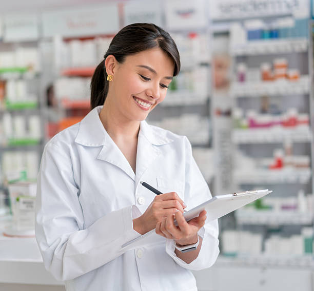 istock Woman working at a drugstore 610254358
