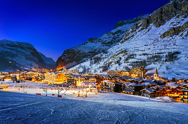 Val d'Isère city Famous and luxury place of Val d'Isere at sunset, Tarentaise, Alps, France apres ski stock pictures, royalty-free photos & images