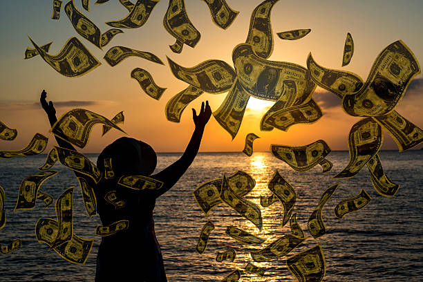 istock It's raining dollars woman on vacation 610254716
