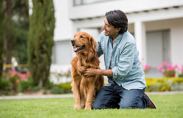 istock Happy man outdoors with his dog 610255120