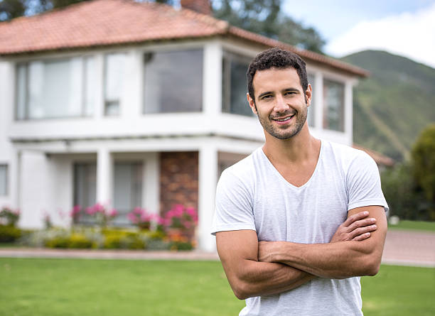 istock Happy man outside the house 610255234