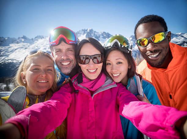 istock Group of friends skiing and taking a selfie 610255522