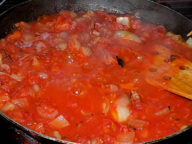 istock Tomato sauce cooking on frying pan 610255780