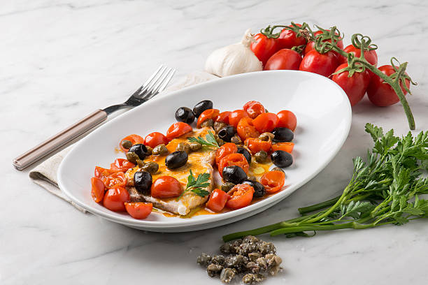 swordfish with tomatoes capers and olive - swordfish imagens e fotografias de stock