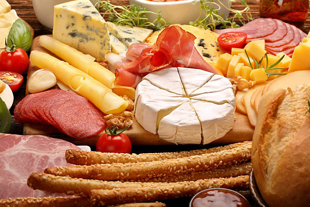 istock Board of various types of cheese and appetizers set 610257644