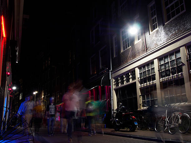istock Bicycles and people in alleyway 610257724