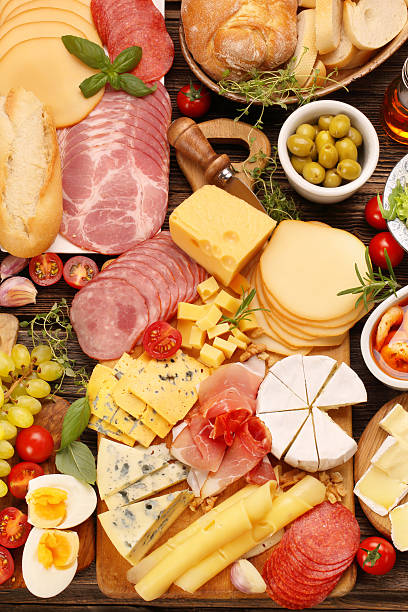 istock Board of various types of cheese and appetizers set 610257840