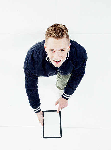 istock Above view of male using tablet 610258808
