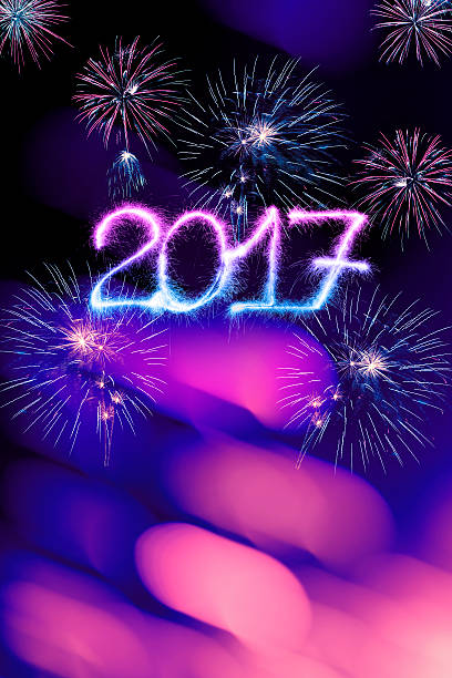 istock Sparkling New Year 2017 and fireworks (purple) 610260038