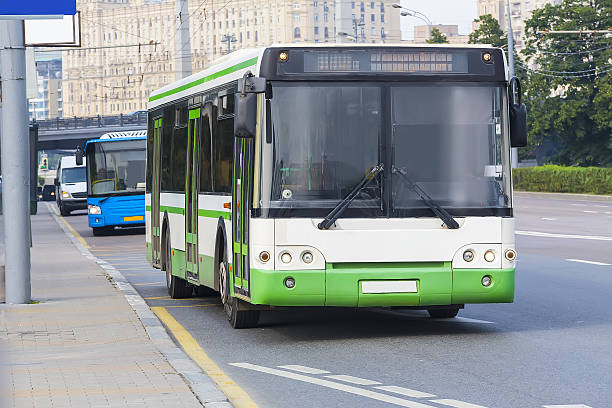 istock city bus goes along street 610263072