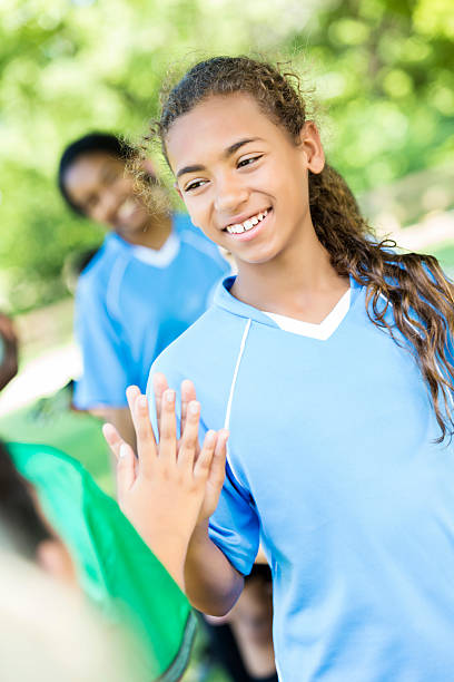 istock Happy soccer player greets opposing team after game 610263726