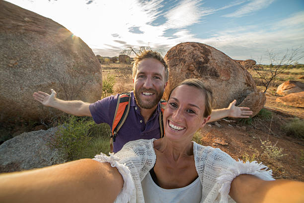 istock Selfie portrait of two young adults at the Devil's Marbles 610408092