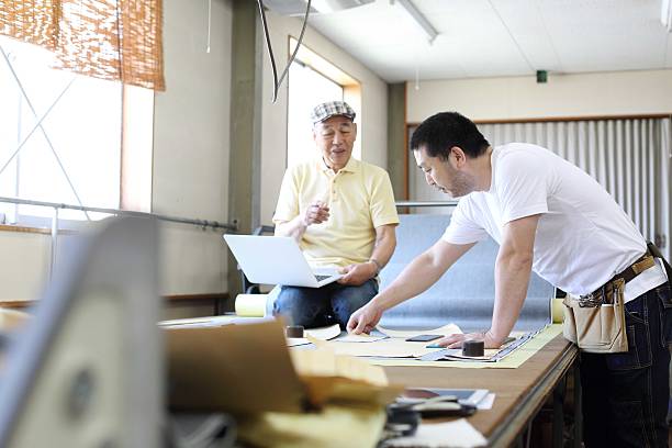 istock The senior tailor who designs jeans with a PC 610408910