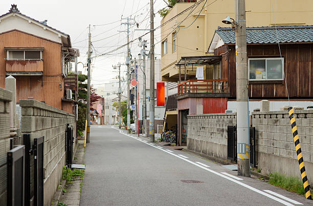 istock Small one way Japanese street panorama 610410426