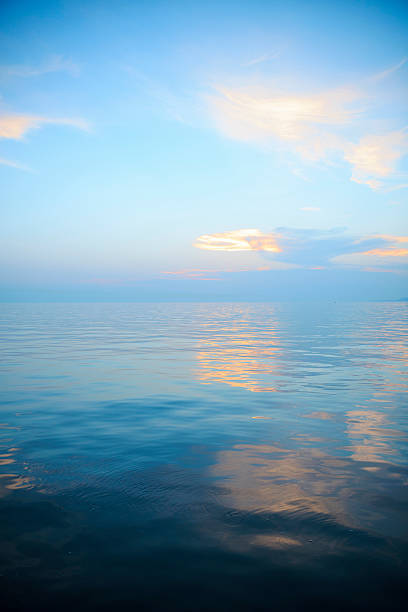 istock Relaxing sunset   The sky with clouds reflected in the sea 610412038