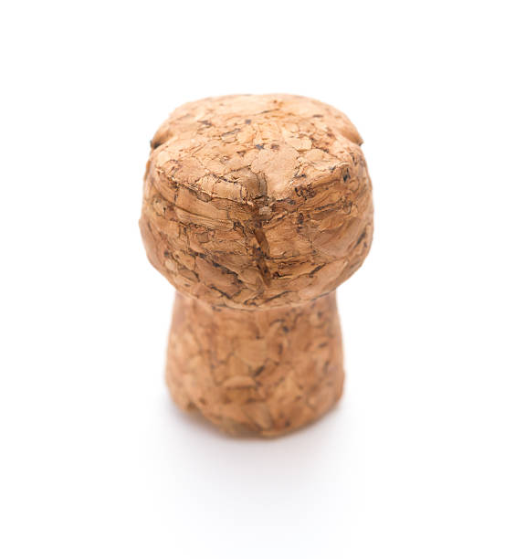 istock wooden cork from champagne bottle on a white backrgound 610412738