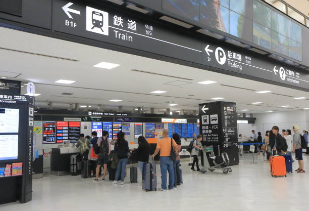 Tokyo Japan - September 23, 2016: People queue to buy train and bus tickets at Narita airport in Tokyo Japan.
