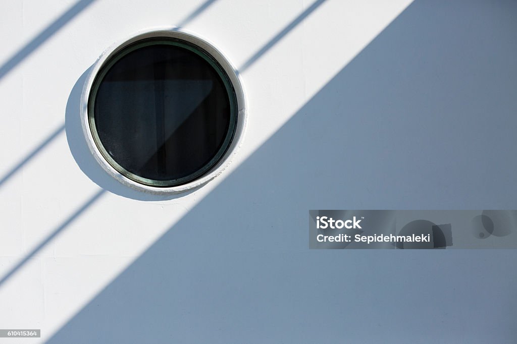 ship porthole- Stock image ship porthole on a white wooden wall with copy space - Stock image.  Vehicle Hatch Stock Photo