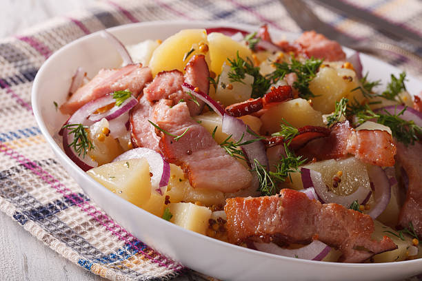 istock Tasty potato salad with bacon and herbs close up. horizontal 610416340