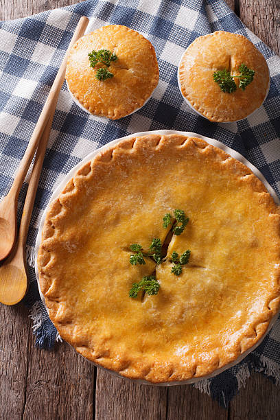istock American Chicken pot pie closeup on table. vertical top view 610418208