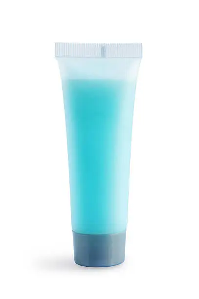 Cosmetic tube mockup. Plastic tube with blue liquid for bodycare isolated on white.