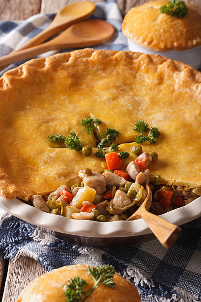 istock Tasty Chicken pot pie close-up in baking dish. Vertical 610420946