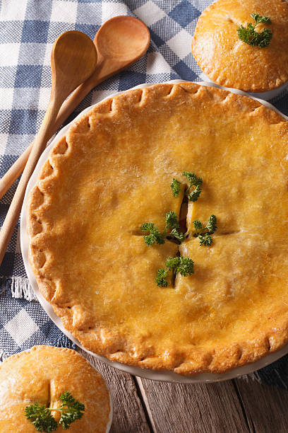 istock Chicken pot pie close-up on the table. vertical top view 610422378