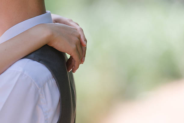 istock Romantic couple hugging in the park 610423330