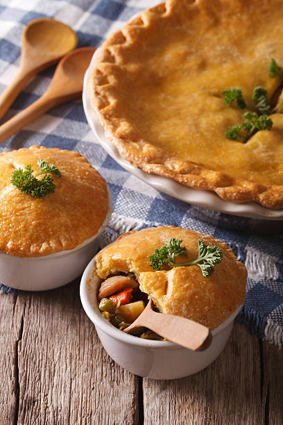 istock American cuisine: chicken pie with vegetables in a pot. vertical 610423518