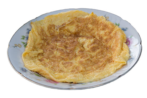 istock Omelet with vegetables in white ceramic plate isolated on white background 610423762