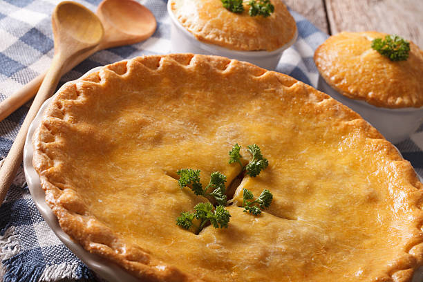 istock Big Chicken pot pie in the baking dish closeup. horizontal 610424328