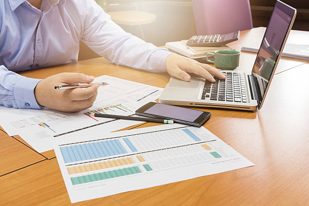 istock Business man working with smartphone and paperwork 610425322