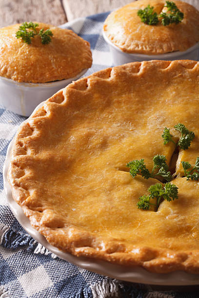 istock Freshly baked Chicken pot pie in the baking dish closeup 610425600