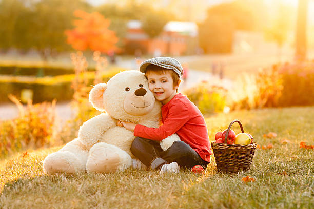 istock Adorable little boy with his teddy bear friend 610426000