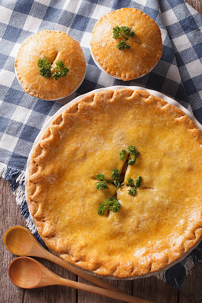 istock Golden Chicken pot pie in the baking dish closeup. Vertical 610426604