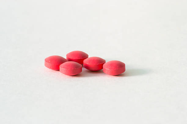 istock Red pills on white background. Medicine. 610427832