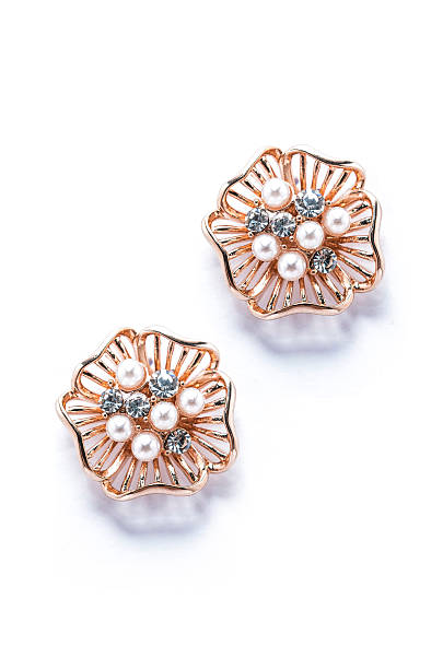 istock gold earrings with pearls on white background 610428034