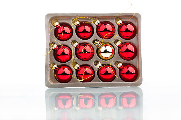 istock Christmas balls in a box over white background 610428114