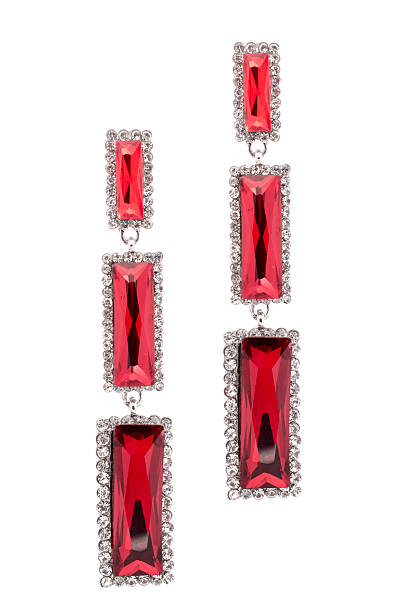 istock Red earrings inlaid with precious stones on a white background 610429866