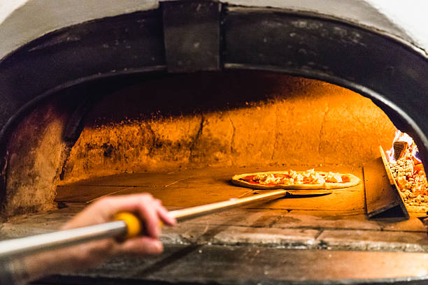 istock Pizza with wood oven 610431278