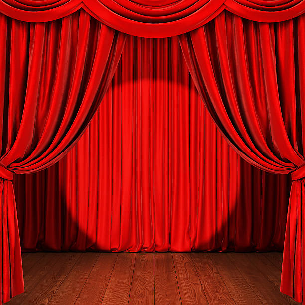 istock Stage with red curtain, wooden floor and spotlight 610431654