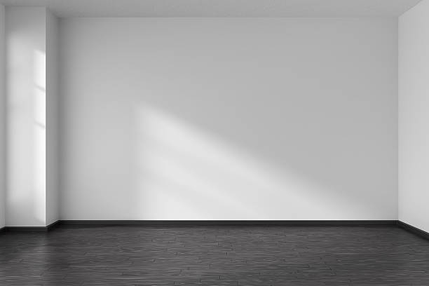 Empty room with angle with parquet floor and white walls