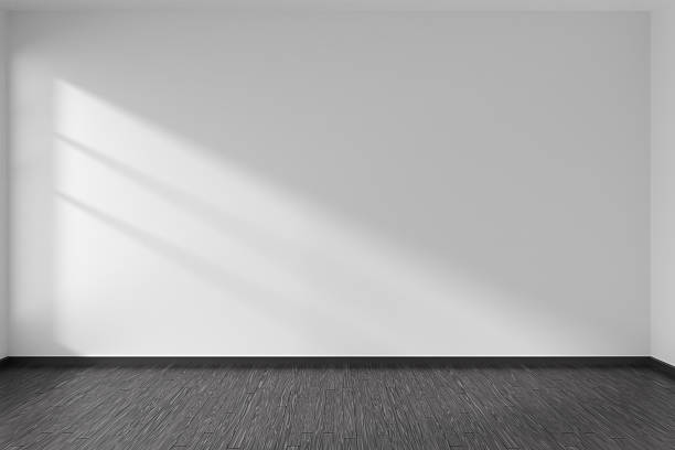 istock Empty room with black parquet floor and white walls 610433302