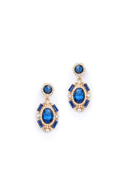 istock earrings with sapphire  on white background 610433742