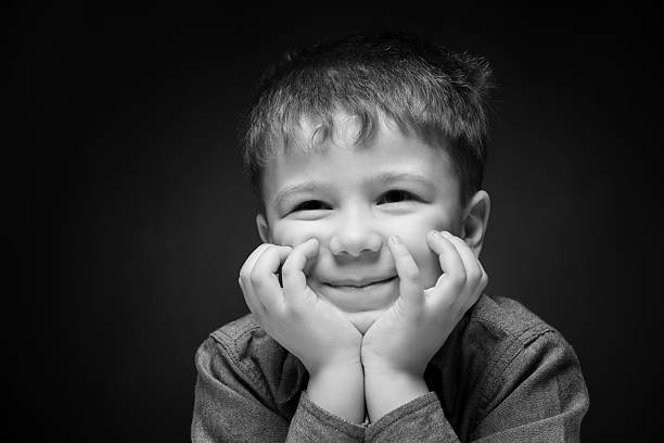 istock portrait of a boy on a dark background 610434678