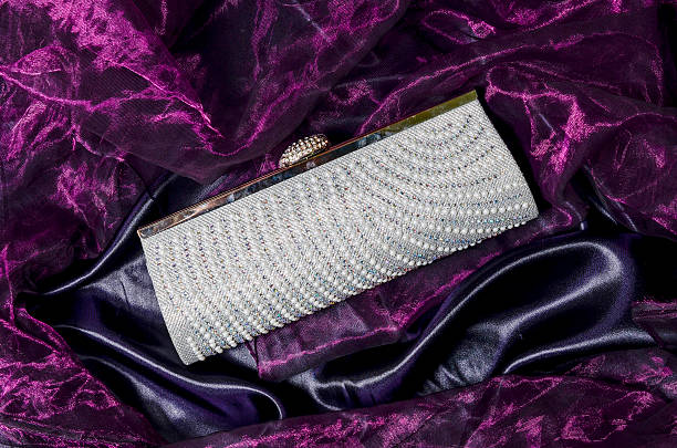 istock clutch with pearls on a silk background 610435066